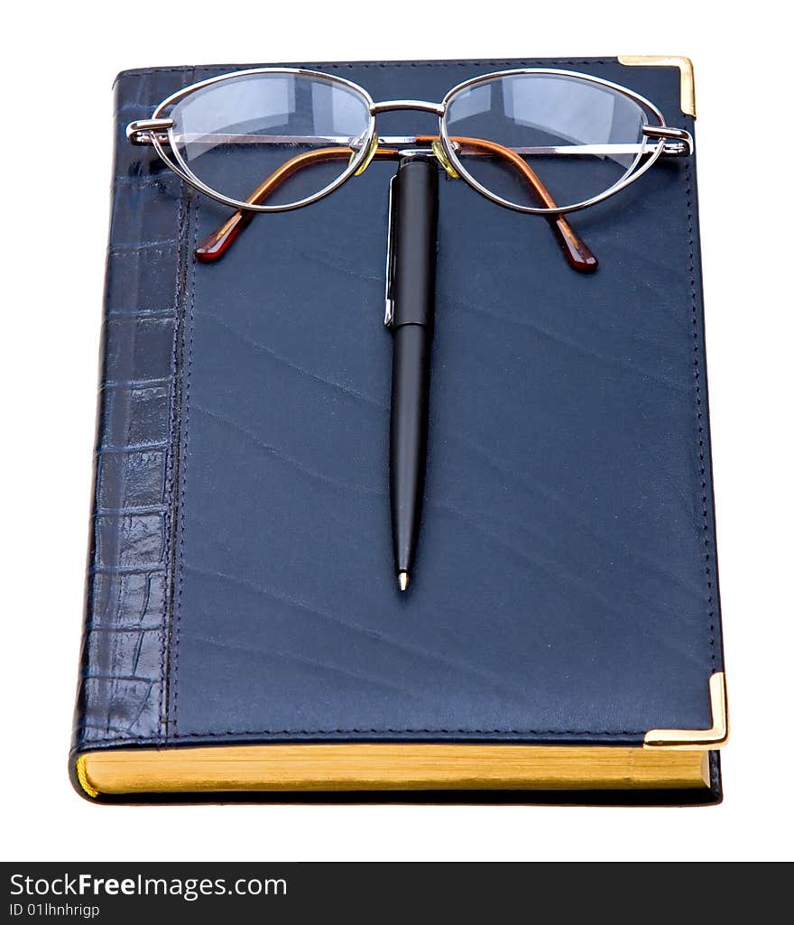 Daily planner with glasses and pen isolated on white background