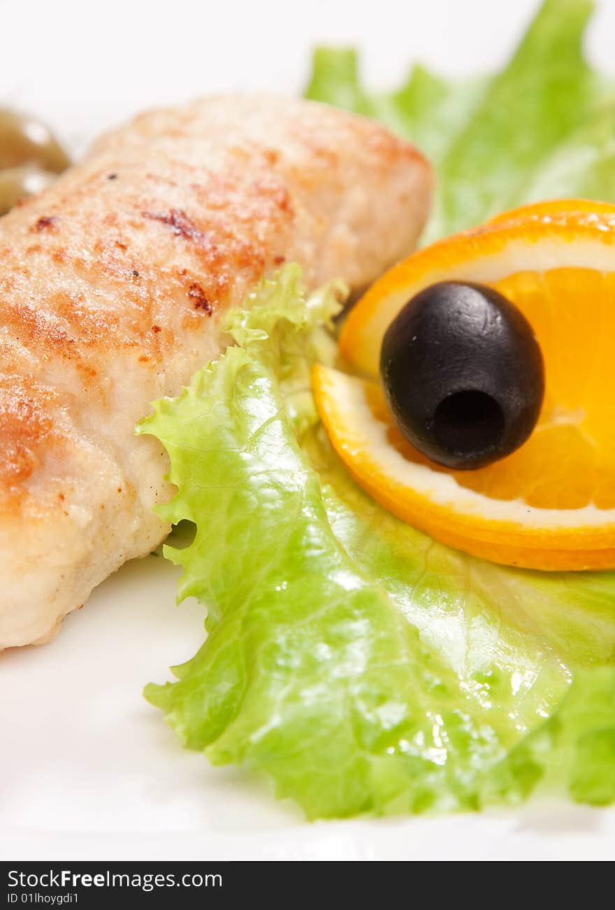 Chop served with salad and orange