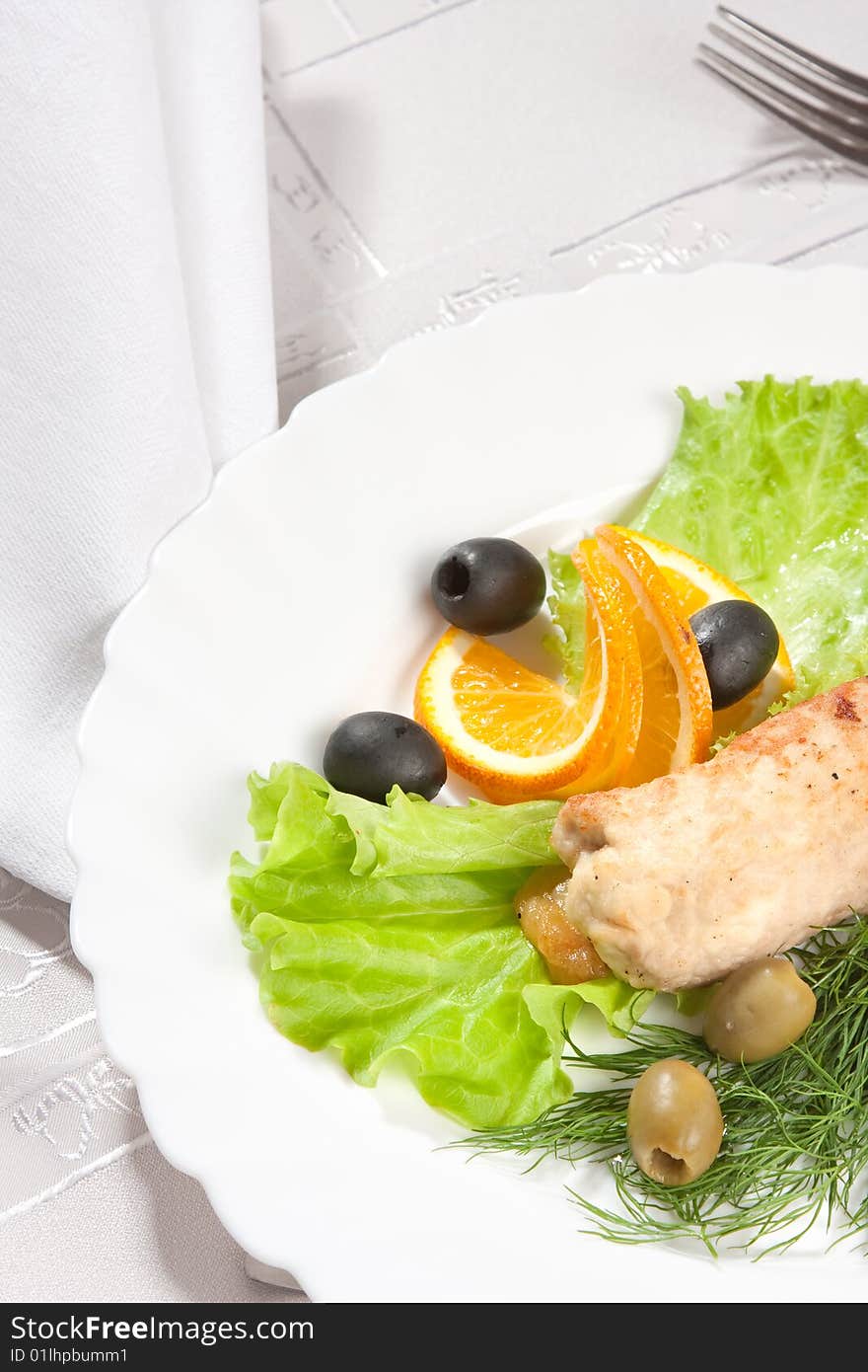 Chop served with salad and olive