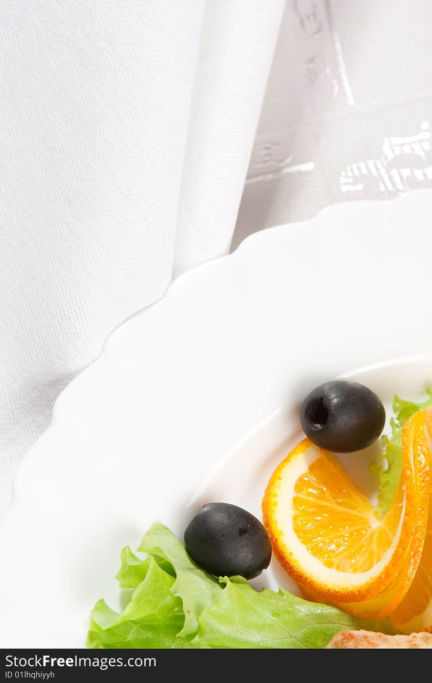 Salad served with orange over white