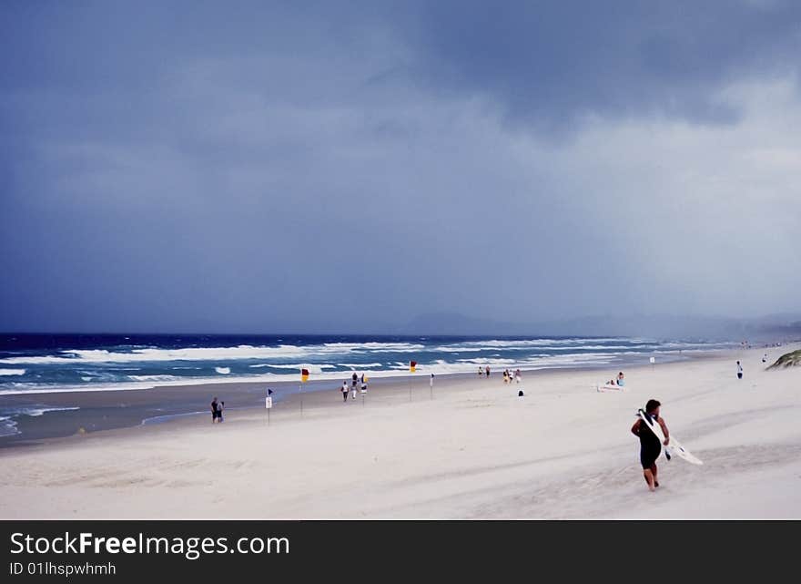 Surfer and people on a beach in australia