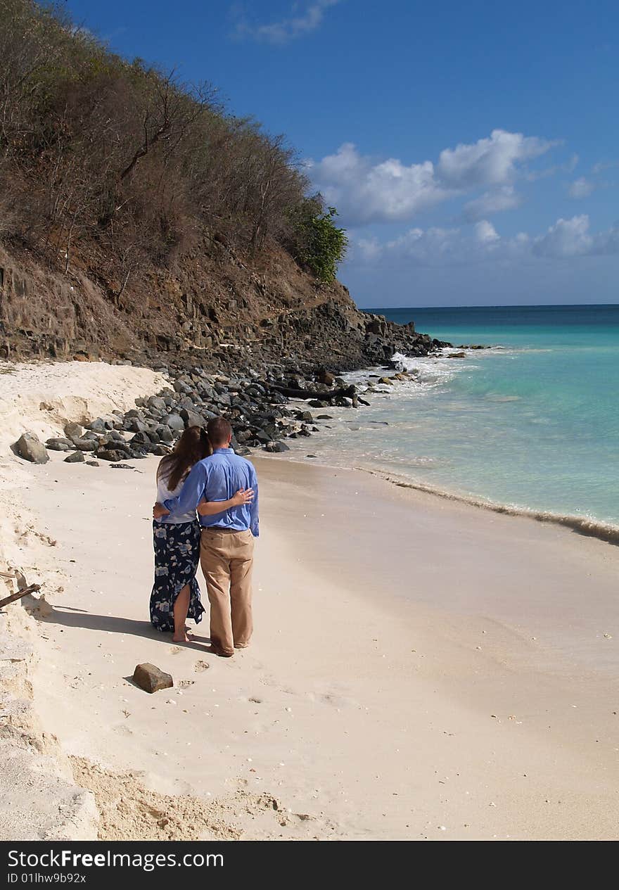 Couple Standing On Frys Beach In Antigua Barbuda