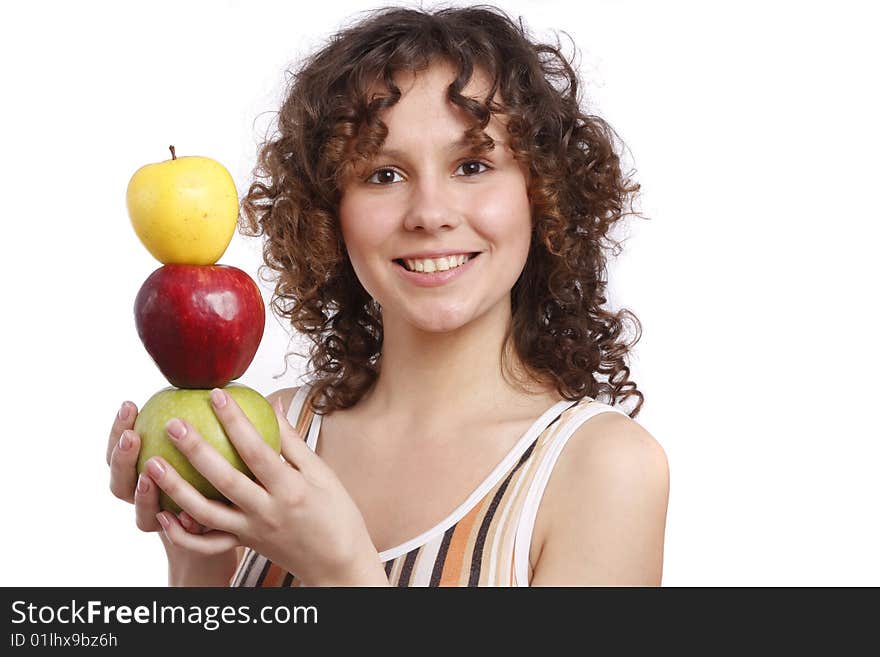 Young smiling woman with three apples. Attractive girl is holding the pyramid of apples. Isolated over white. Young smiling woman with three apples. Attractive girl is holding the pyramid of apples. Isolated over white.