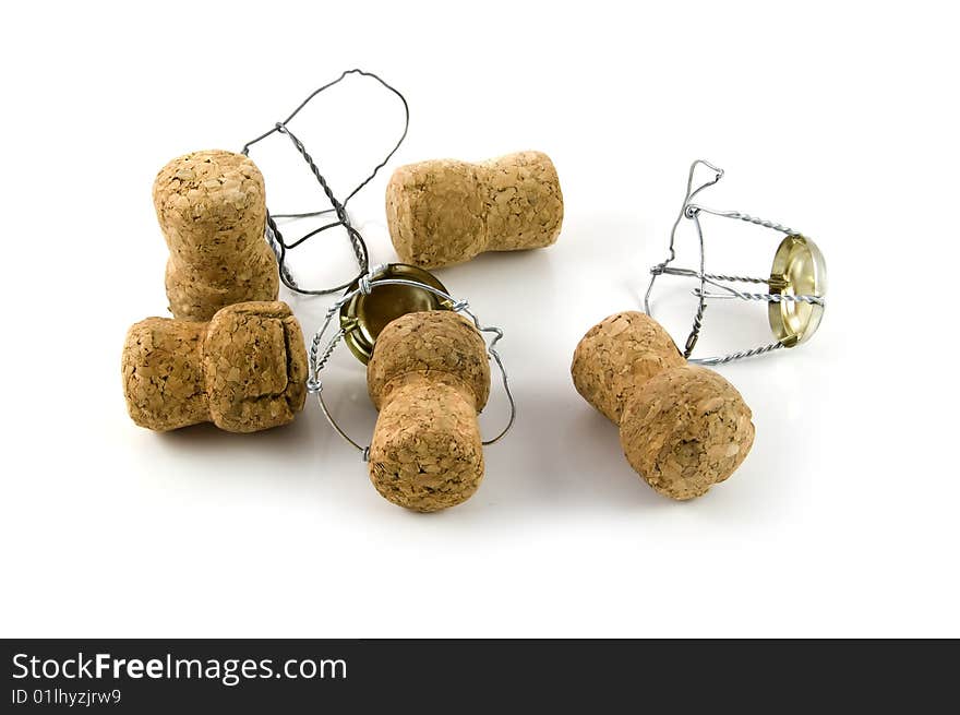 Five corks from champagne on a white background