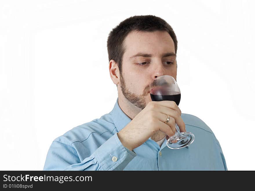 Young man drinking the red wine