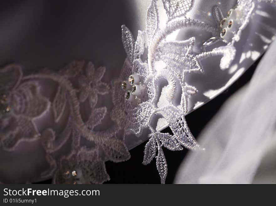 Macro picture of lace on the wedding dress