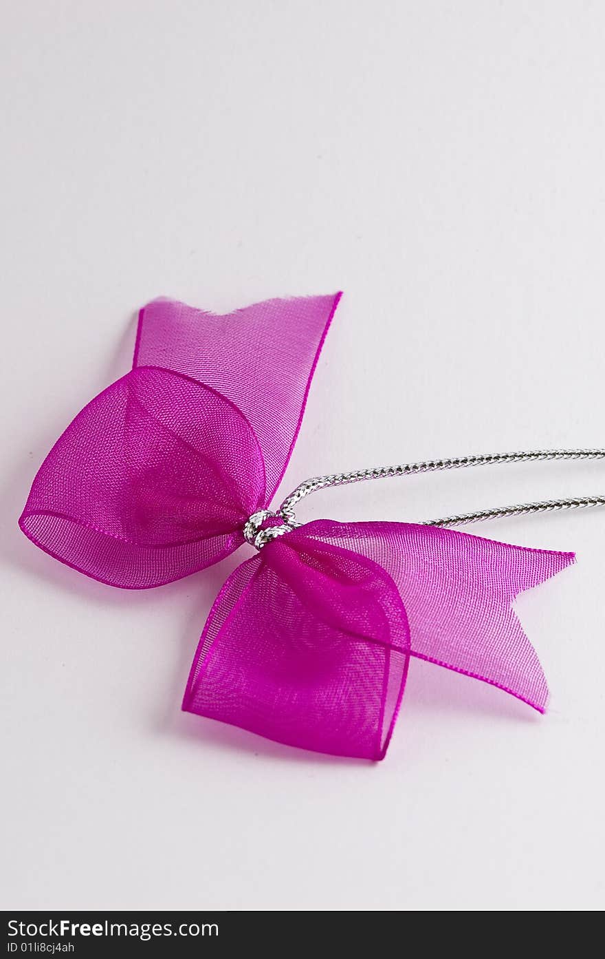 Pink bow tie ribbon with silver cord