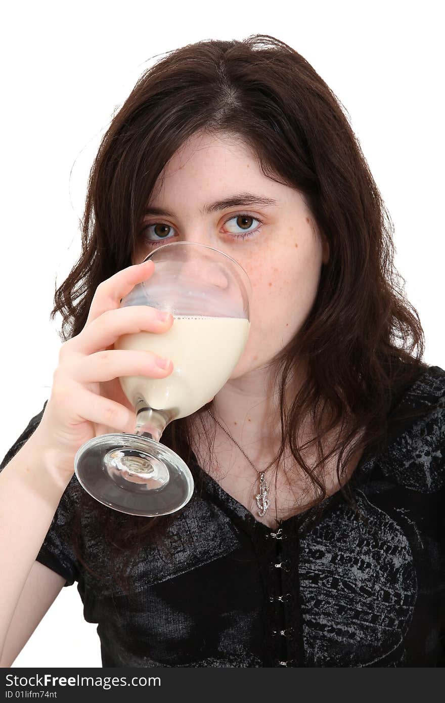 Beautiful teen girl drinking glass of soymilk (soy milk) over white background. Beautiful teen girl drinking glass of soymilk (soy milk) over white background.