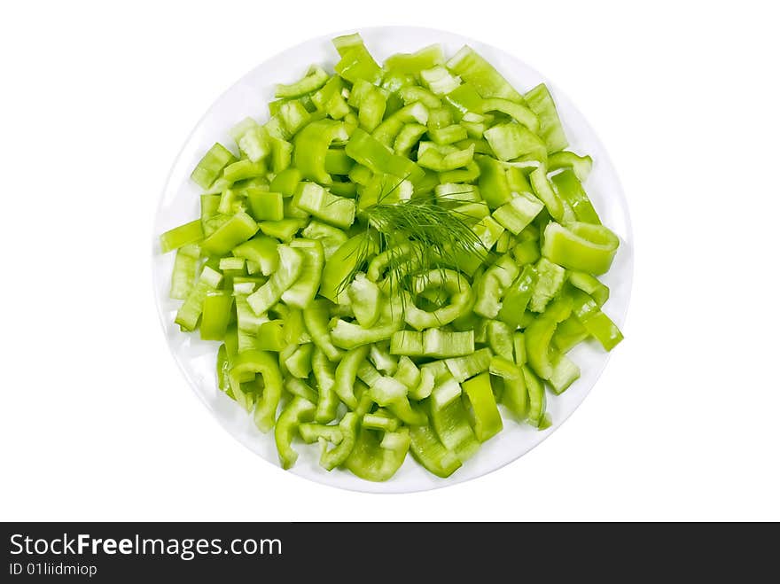 Green chopped pepper on a plate. Green chopped pepper on a plate