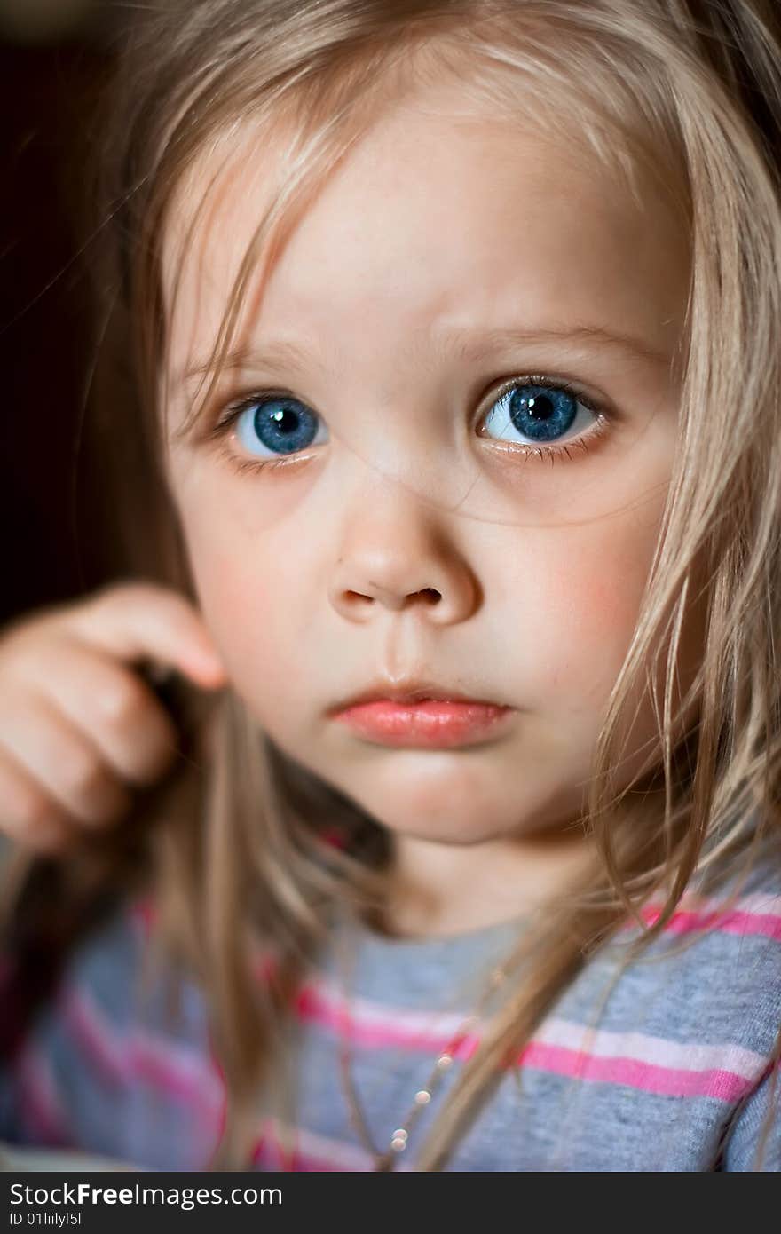 Portrait of the small beautiful girl