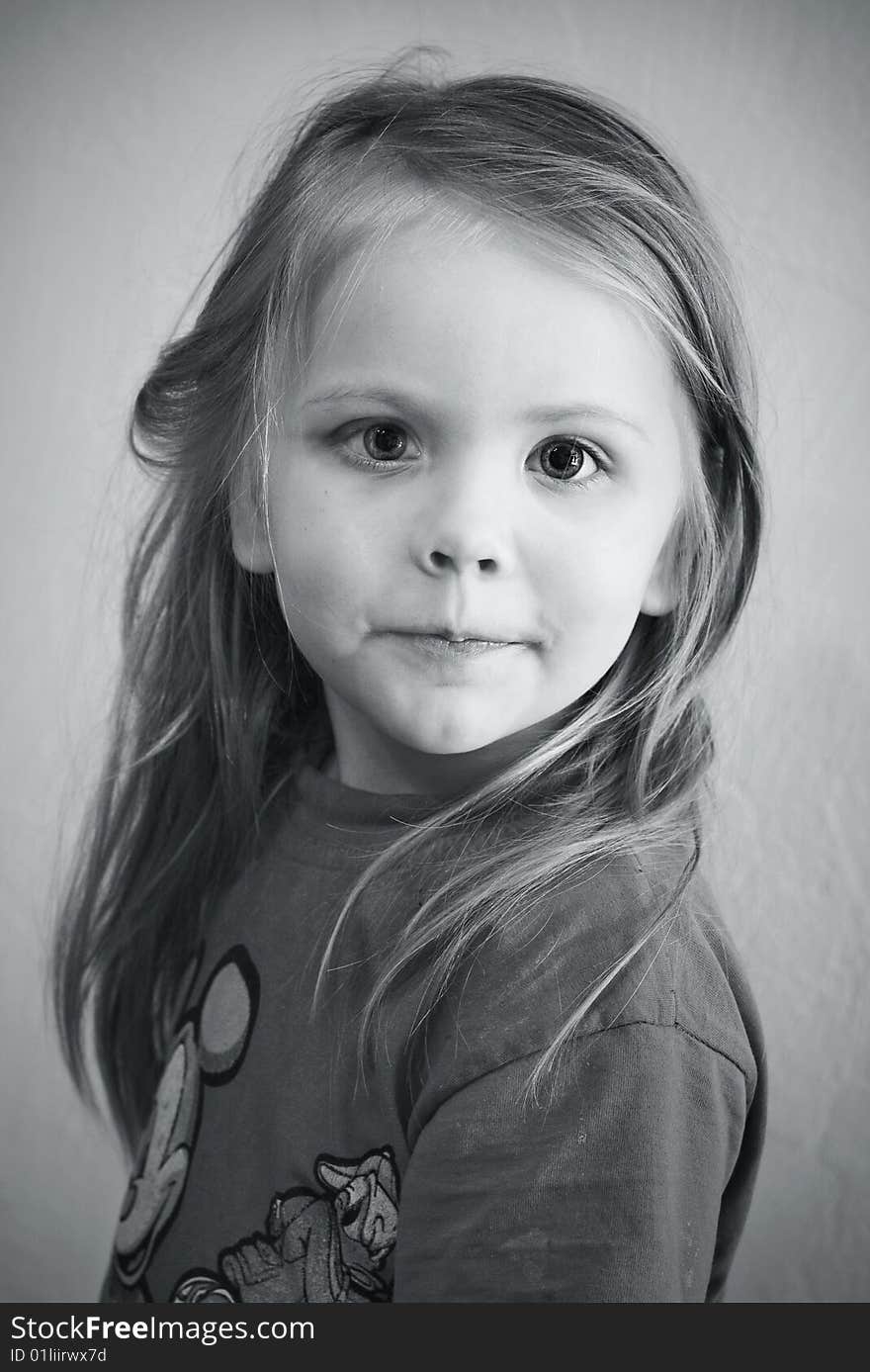 Portrait of the small beautiful girl