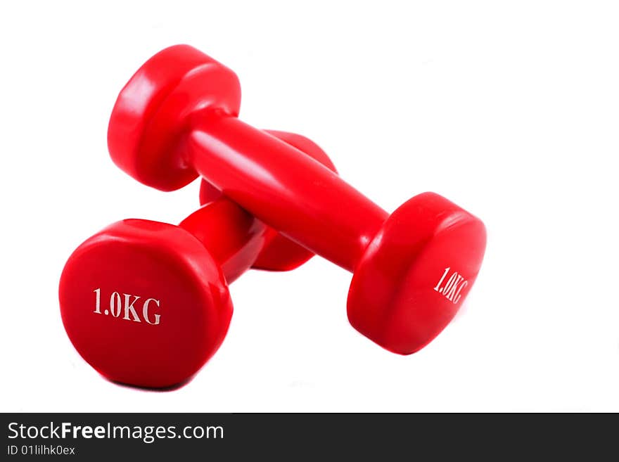 Two dumbbells against a white background. Two dumbbells against a white background