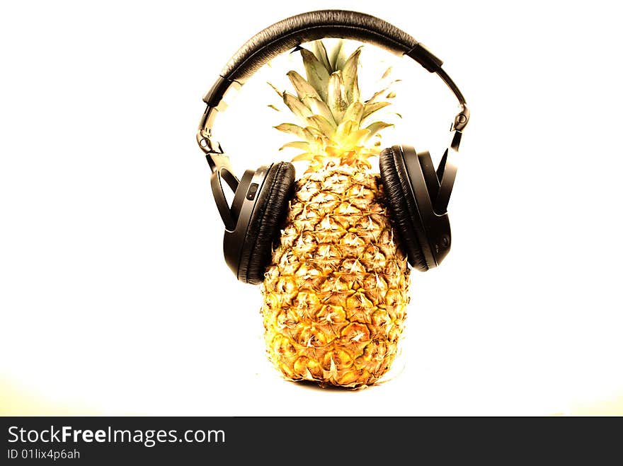 Closeup isolated pineapple with headphone. Closeup isolated pineapple with headphone