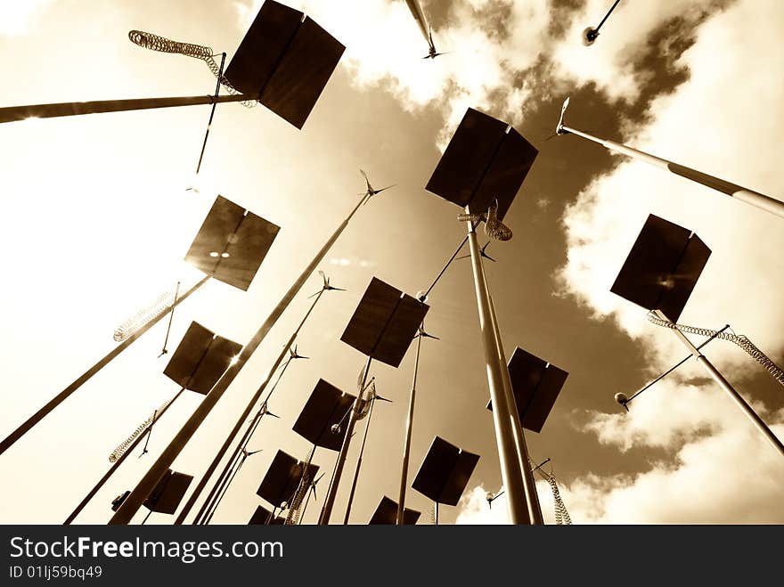 Sepia toned image of wind turbines and solar panels. Sepia toned image of wind turbines and solar panels