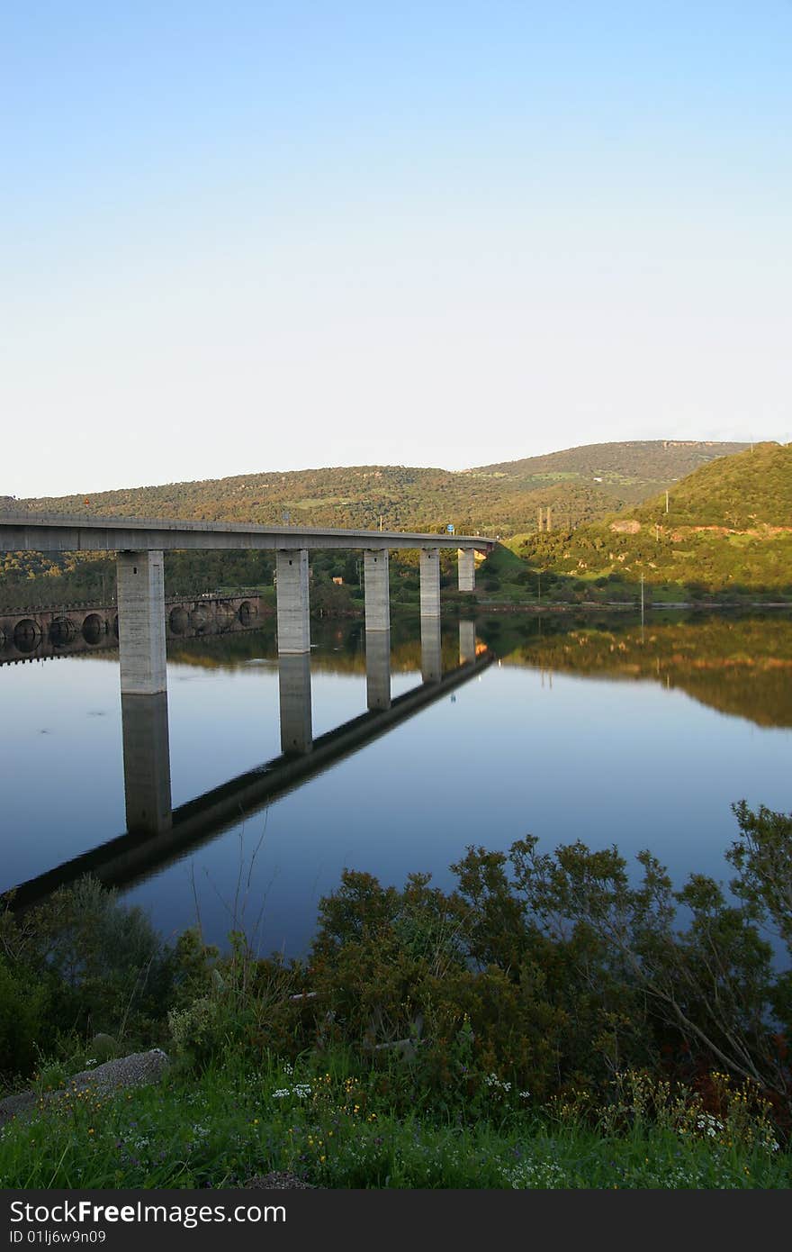 A Bridge reflected into a lake - Sardinia, Italy. A Bridge reflected into a lake - Sardinia, Italy