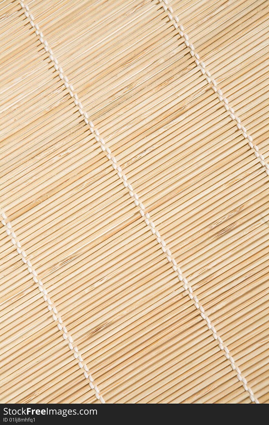 Bamboo mat with white threads texture in diagonal. Bamboo mat with white threads texture in diagonal