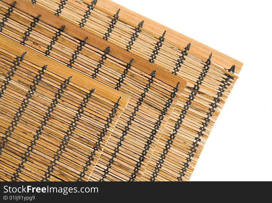 Three bamboo mats corners on white background horizontal. Three bamboo mats corners on white background horizontal