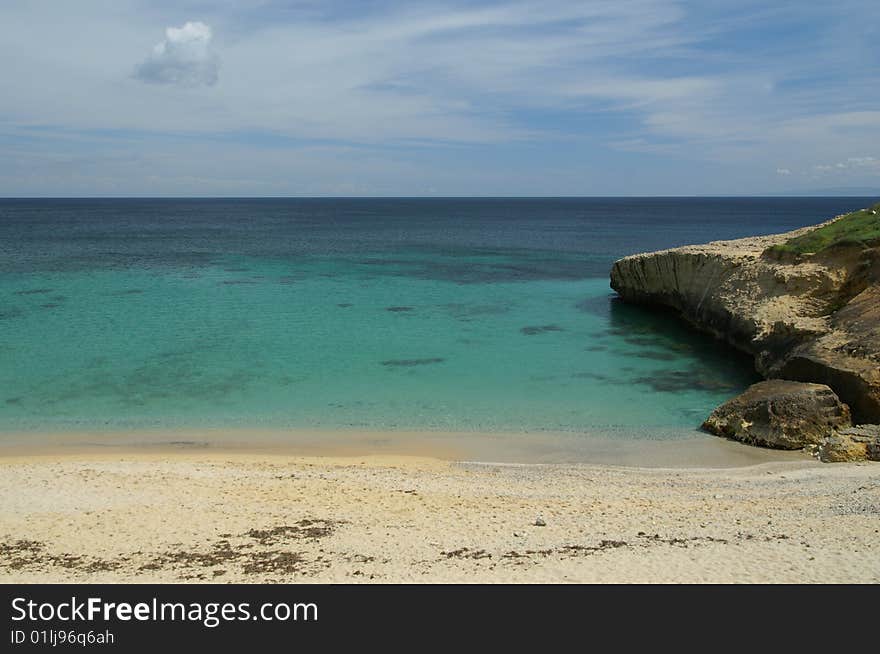 A shoot of rock and beach in the sea of Portotorres - Sardinia. A shoot of rock and beach in the sea of Portotorres - Sardinia