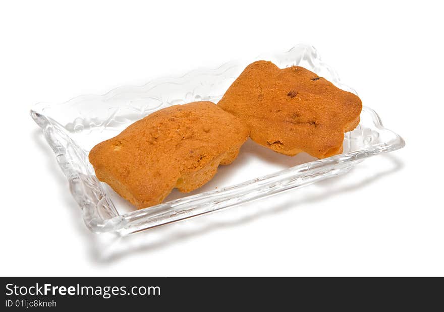 Two cakes on a glass plate isolated