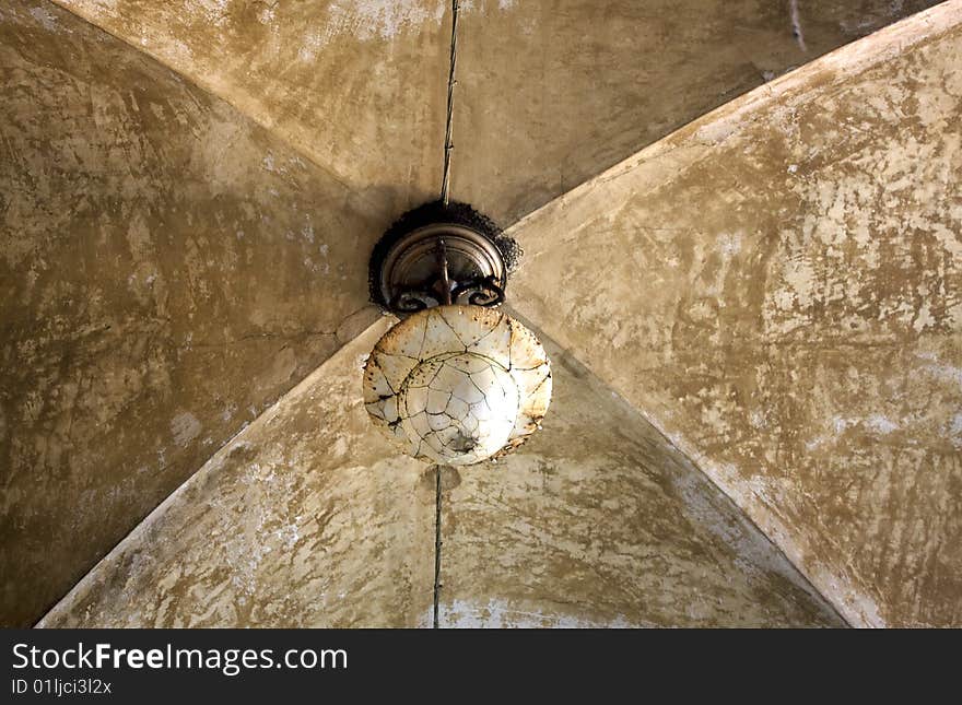 Old chandelier in a vaulted ceiling