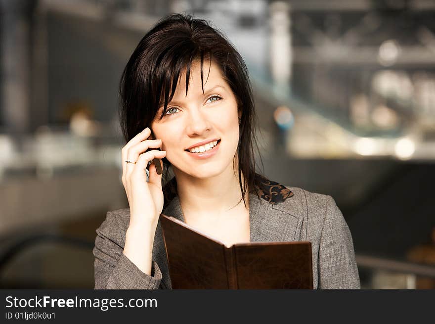 Young confident caucasian businesswoman in the working space. Young confident caucasian businesswoman in the working space