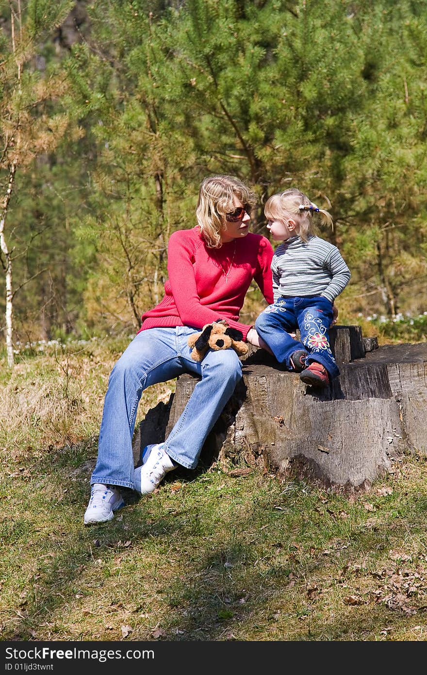 Mother with a child on the nature