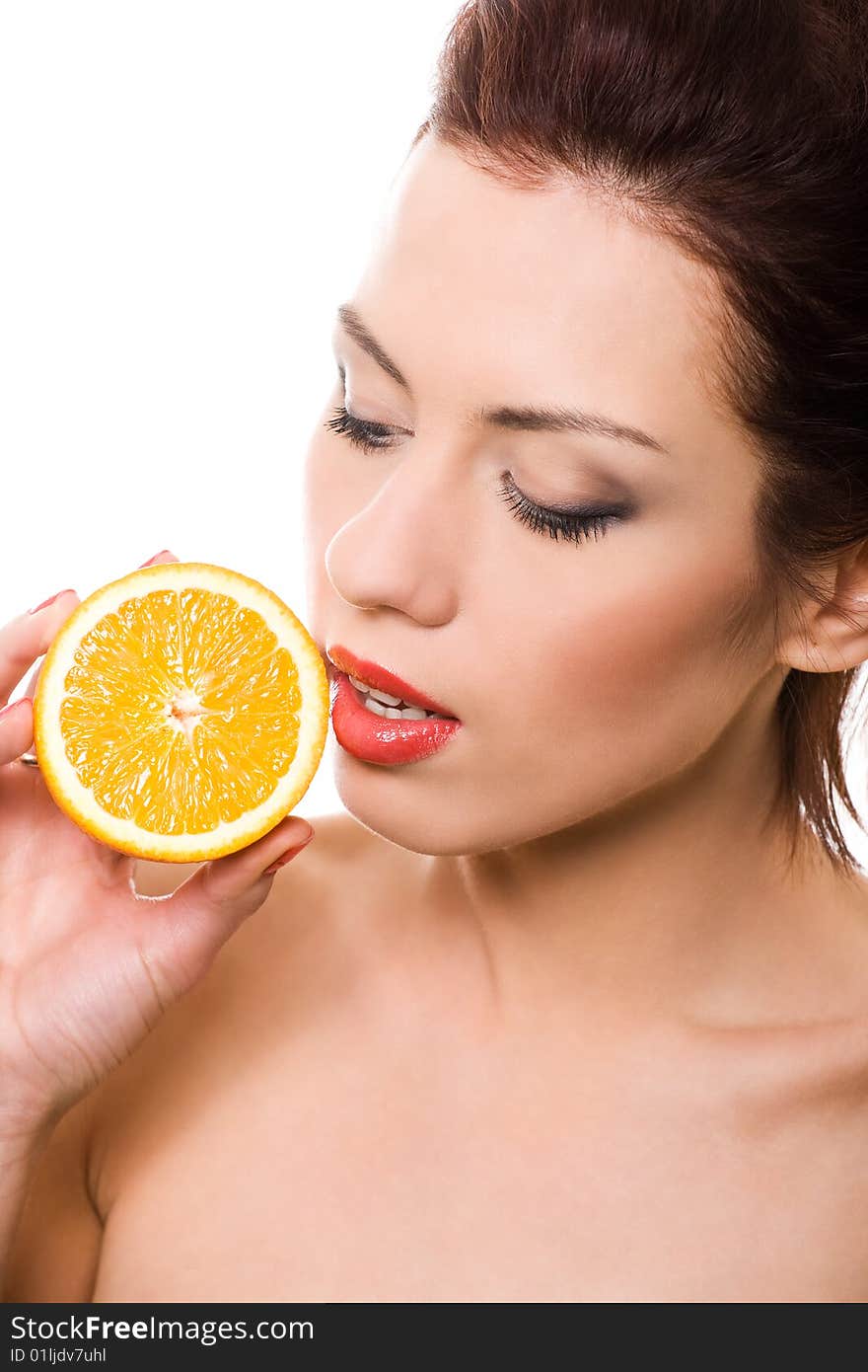 Closeup portrait of girl with half of orange over white. Closeup portrait of girl with half of orange over white