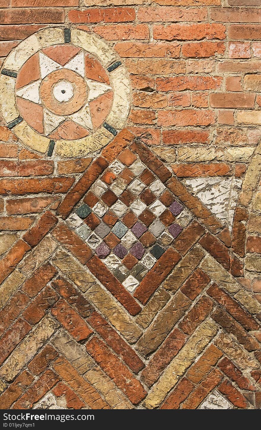 Brick wall with decorative mosaic