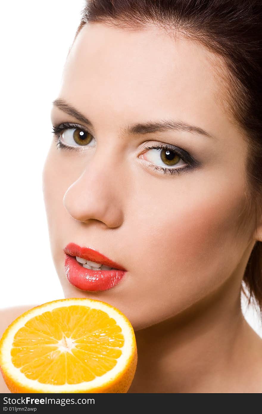 Closeup portrait of girl with half of orange over white. Closeup portrait of girl with half of orange over white