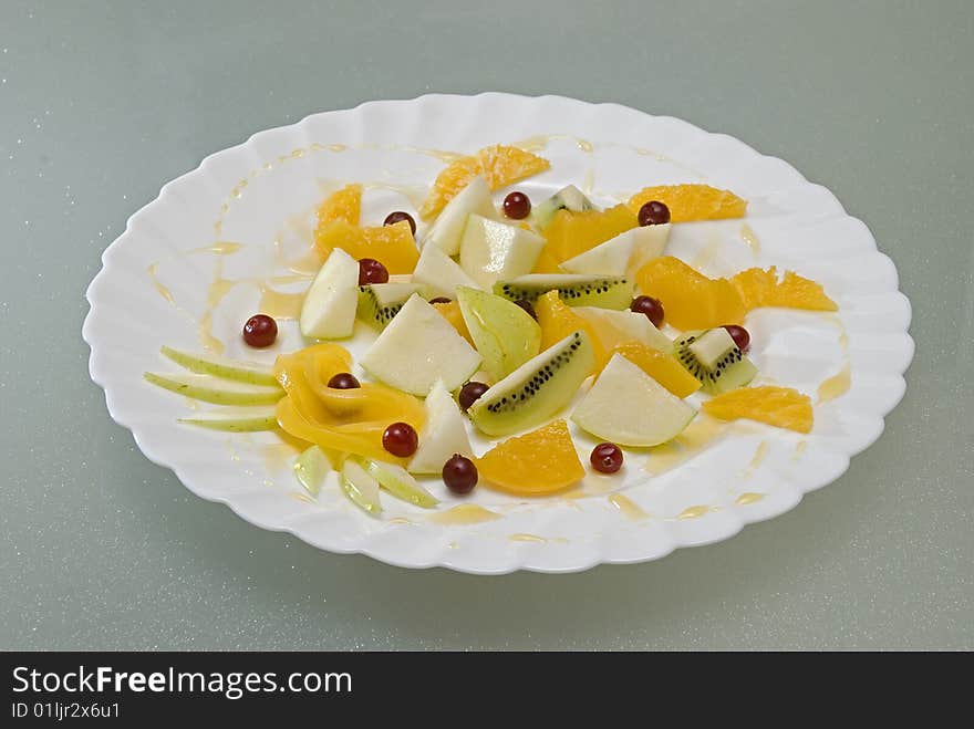 Salad from fruit and berries with honey