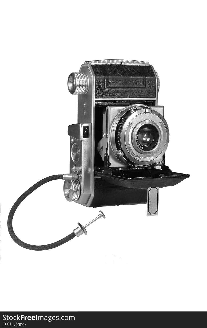 An old film camera with sliding lens and launching cable. An old film camera with sliding lens and launching cable.