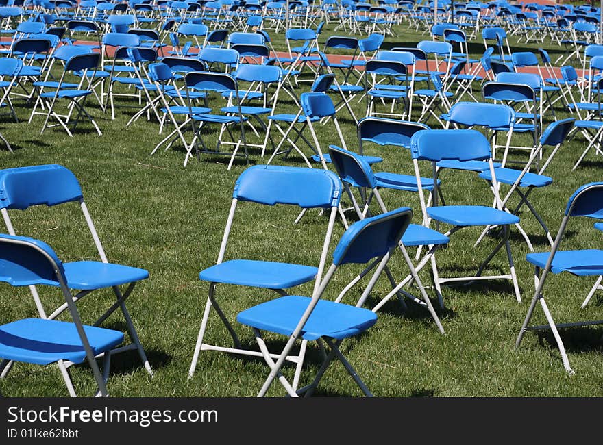 Groups of blue chairs that are empty are a metaphor for such things as opportunities, placement, and emptiness. Groups of blue chairs that are empty are a metaphor for such things as opportunities, placement, and emptiness.