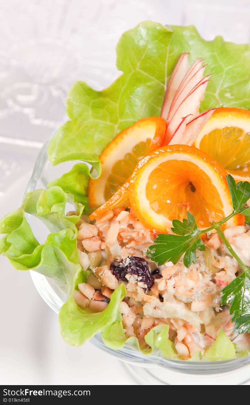 Tasty green salad with apples and nuts