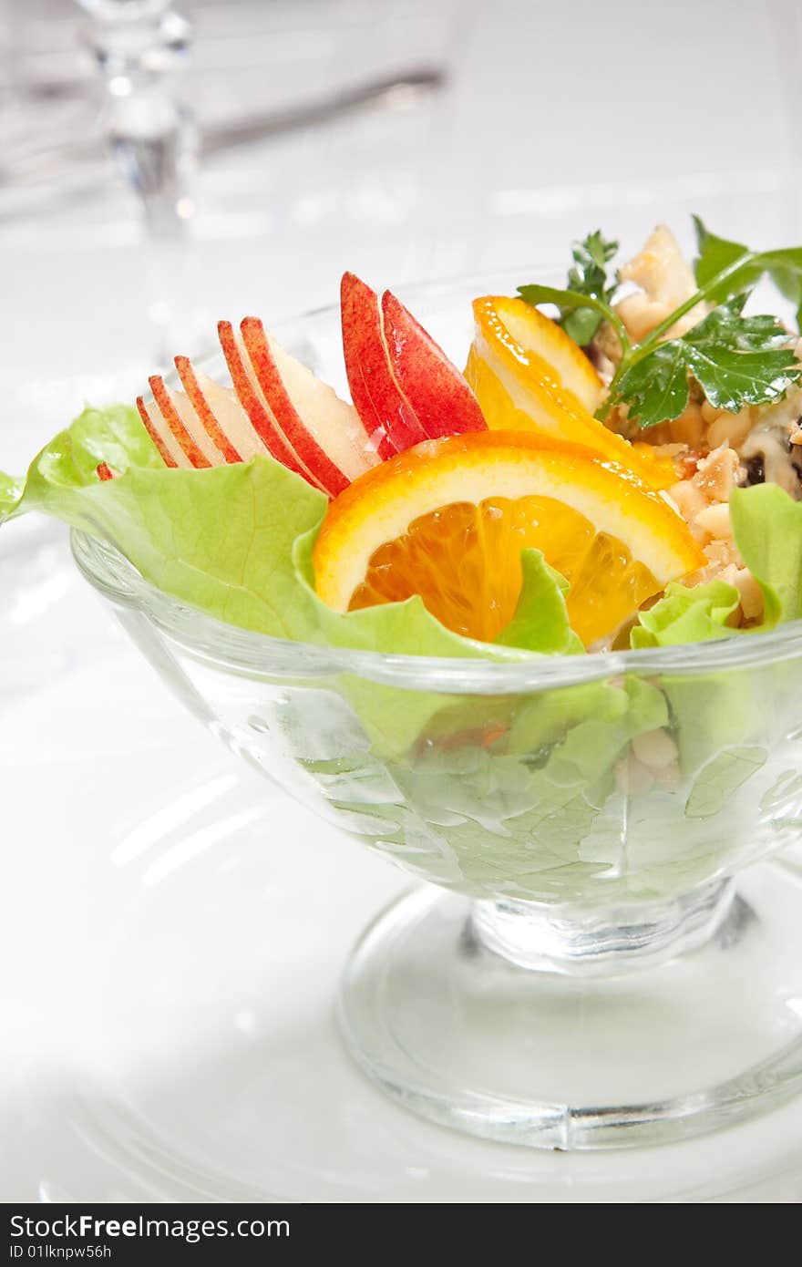 Salad with apples and nuts close up