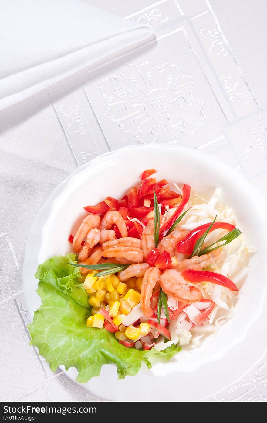 Plate of delicious salad with prawns and corn