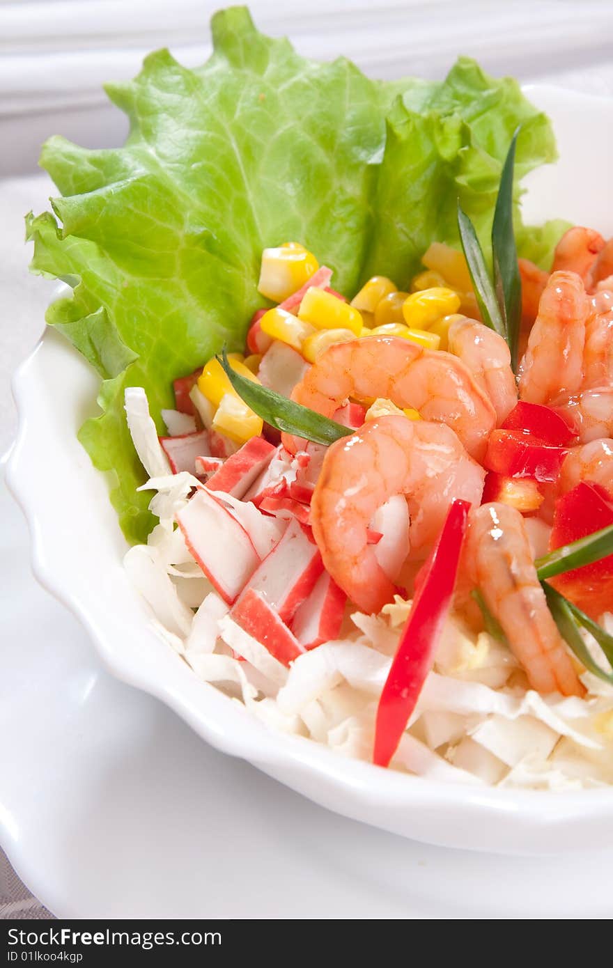 Delicious salad with prawns and corn close up