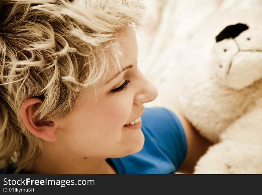 Young smiling beauty with teddy bear. Young smiling beauty with teddy bear.