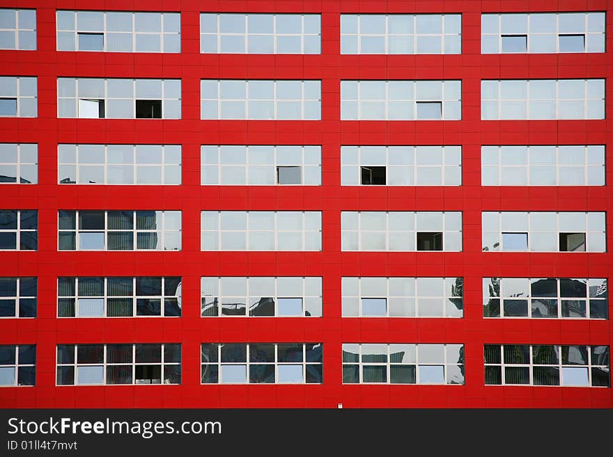 Background of multi glass windows on red building