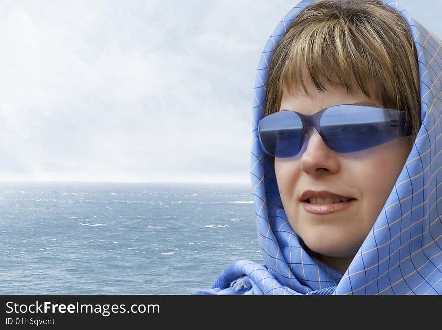 Portrait of a young woman looking out over the sea