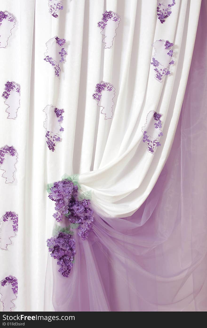 Fragment of a portiere with lilac inflorescences