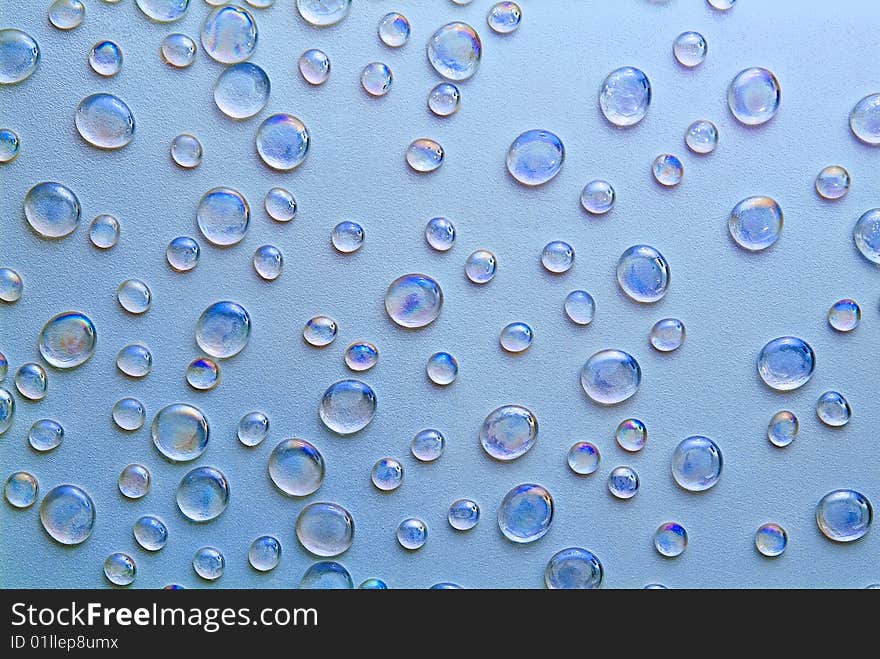 Beautiful background from droplets on a dark blue background