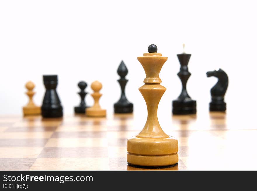 Some chessmen on a chessboard, white background