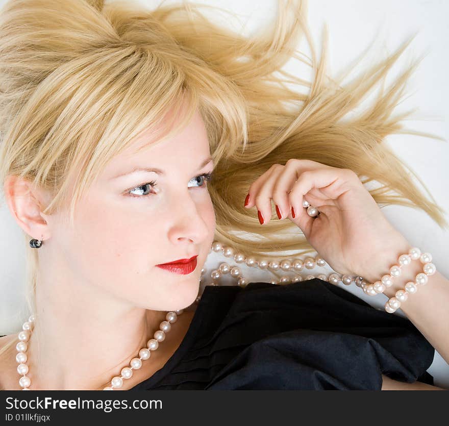 Woman thinking in a relaxed pose. Isolated on white background