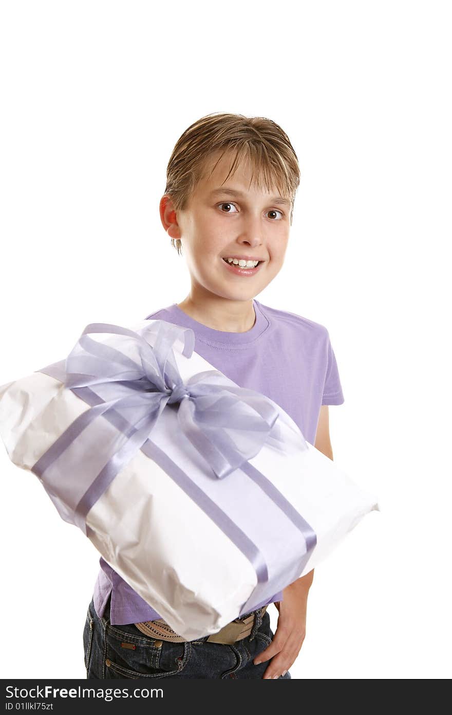 A boy holds a wrapped present tied up with gauze and satin purple ribbon. A boy holds a wrapped present tied up with gauze and satin purple ribbon.