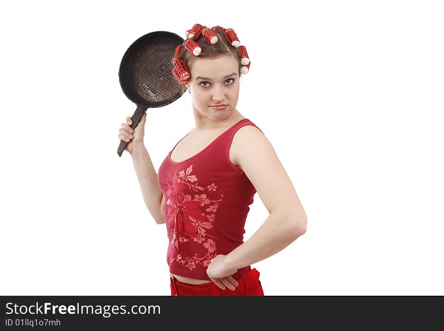 Housewife with curlers , holding a frying pan.