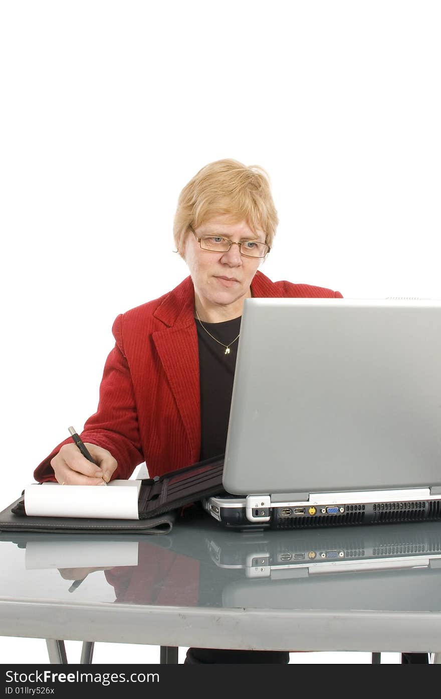 Succesfull businesswoman is looking at her finance stats with a smile