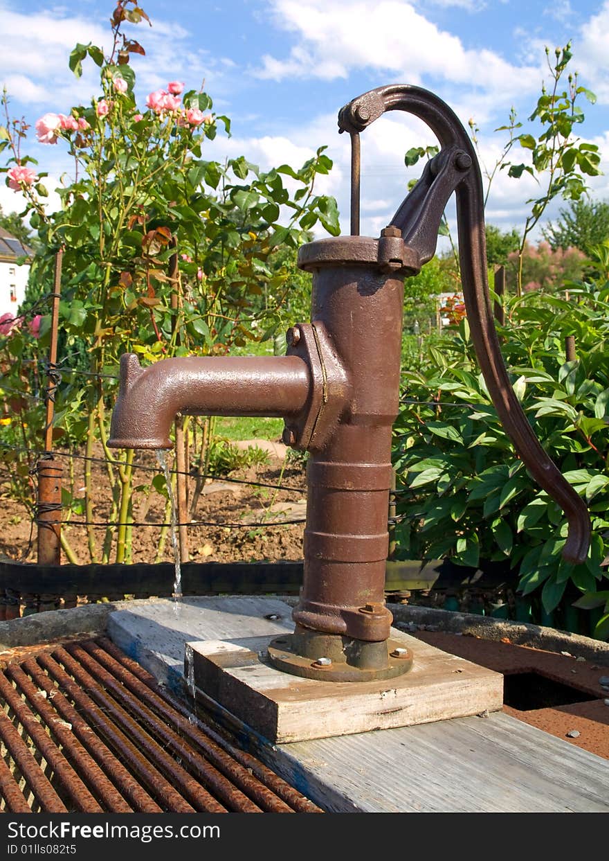 Old water-dispensing in garden.