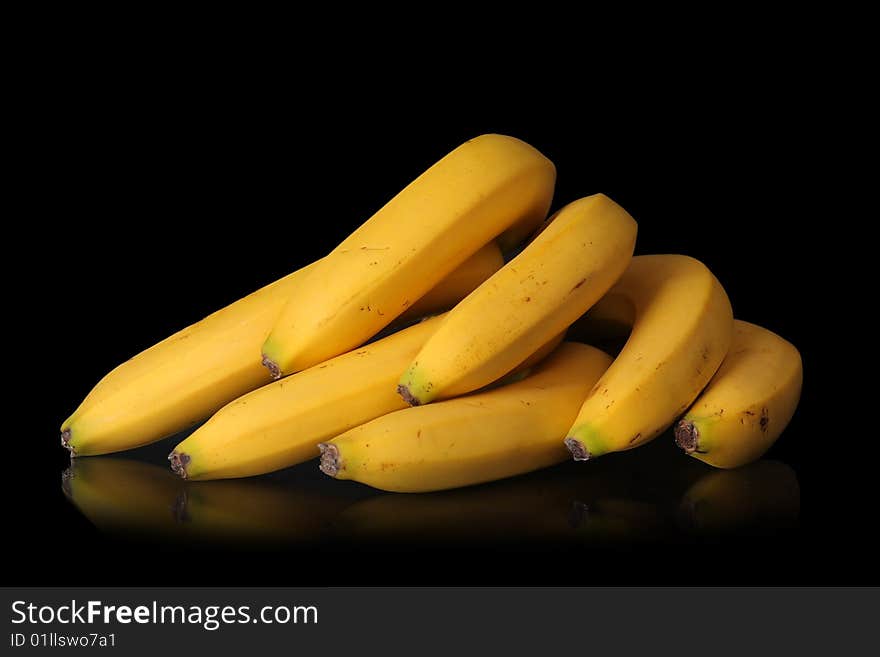 Ripe bananas on black background