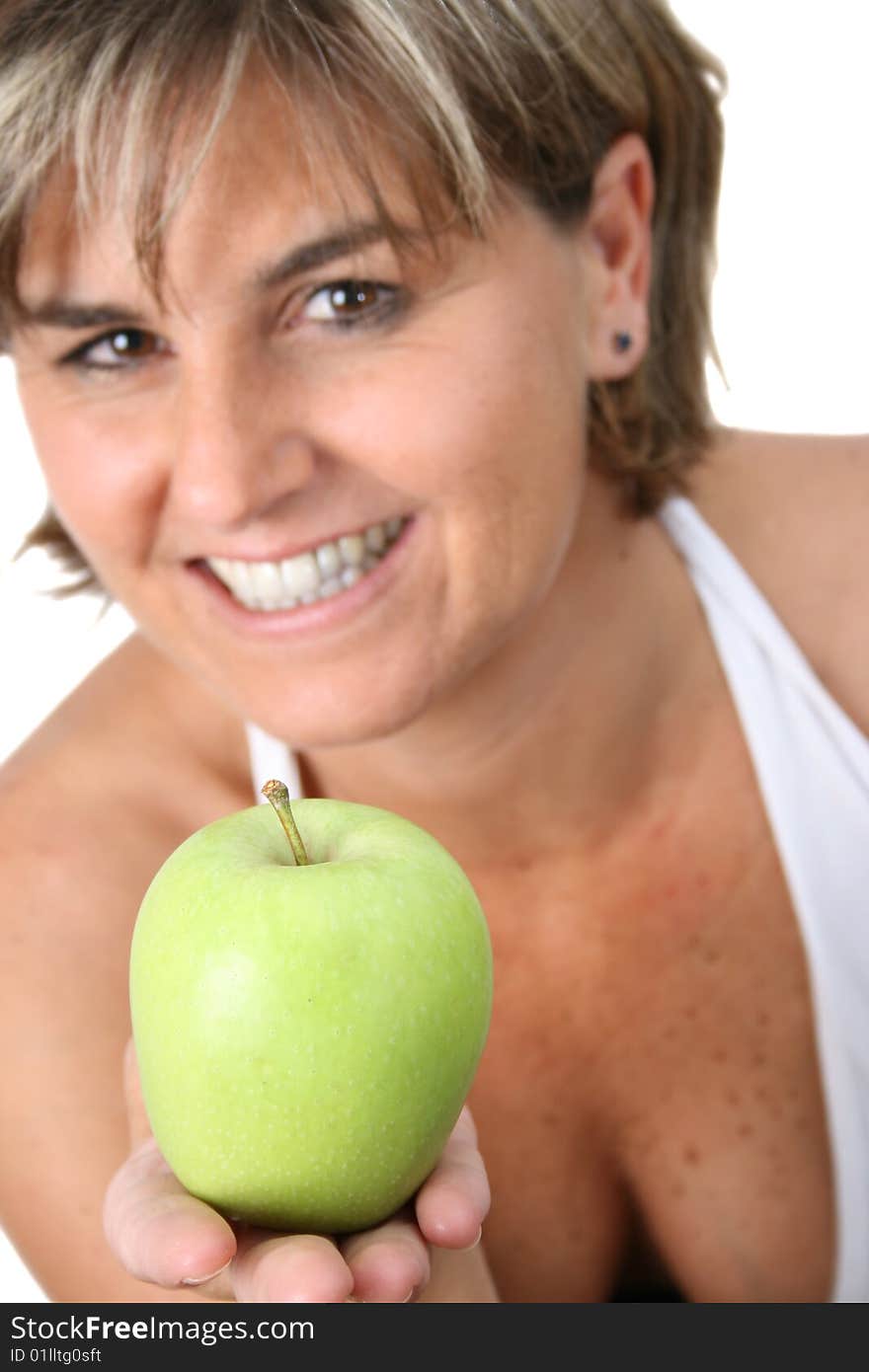 Beautiful mature female holding fruit. FOCUS ON APPLE. Beautiful mature female holding fruit. FOCUS ON APPLE