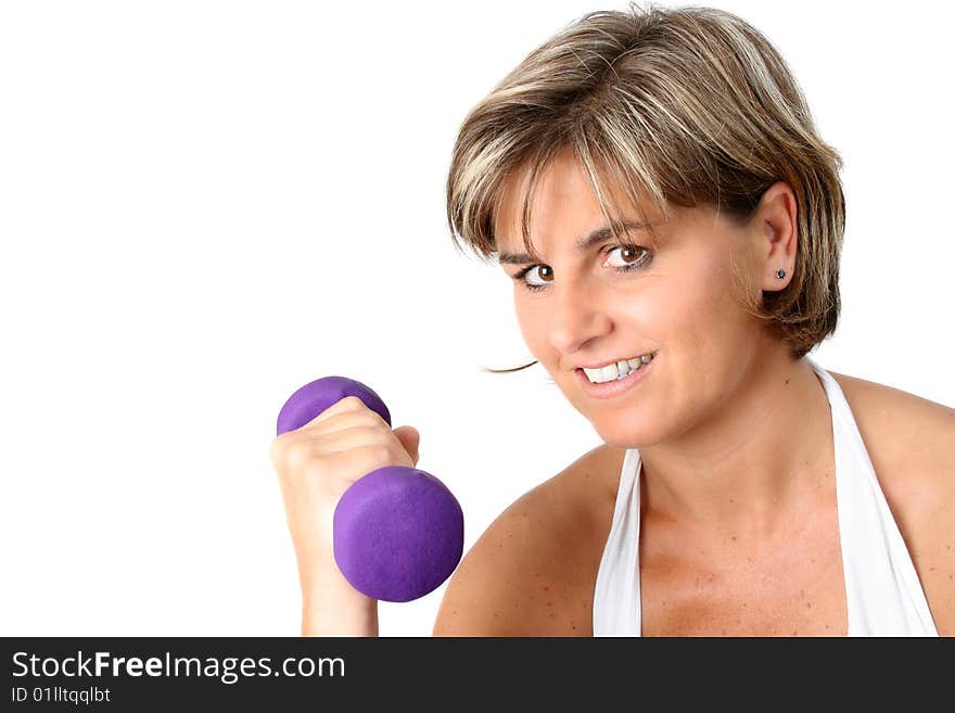 Friendly mature female exercising with small weights. Friendly mature female exercising with small weights